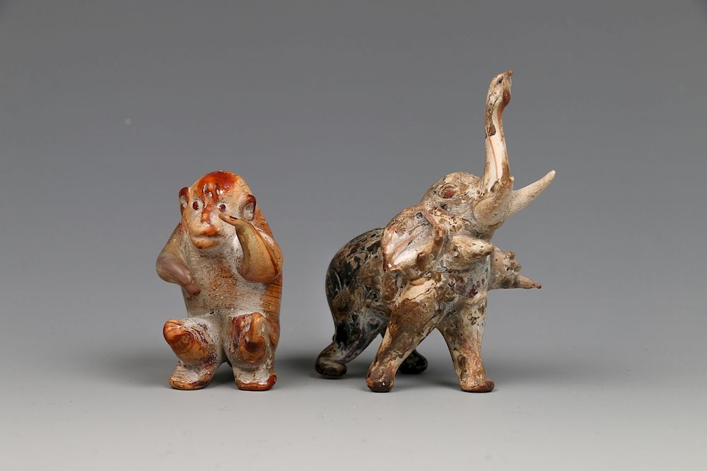 Appraisal: SET OF TWO GLASS MONKEY AND ELEPHANT CARVINGS Two vividly