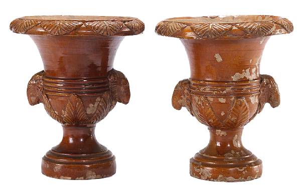 Appraisal: A pair of French glazed terracotta urns th century Each