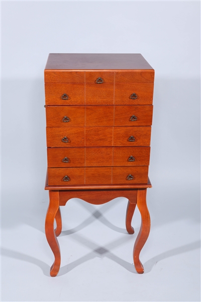 Appraisal: Four legged wooden silver chest with multiple compartments and brass