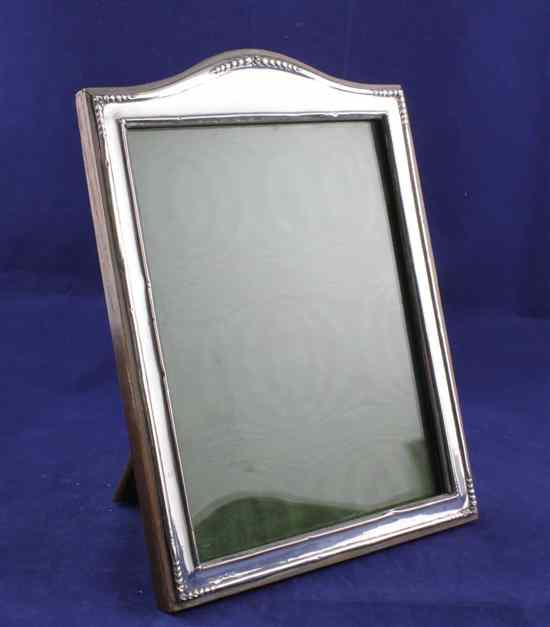 Appraisal: A George V silver domed top rectangular photograph frame with