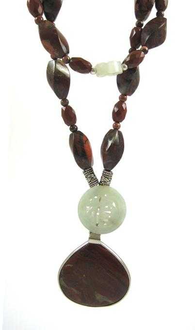 Appraisal: DOUBLE STRAND RED JASPER AND JADE NECKLACE strung with red