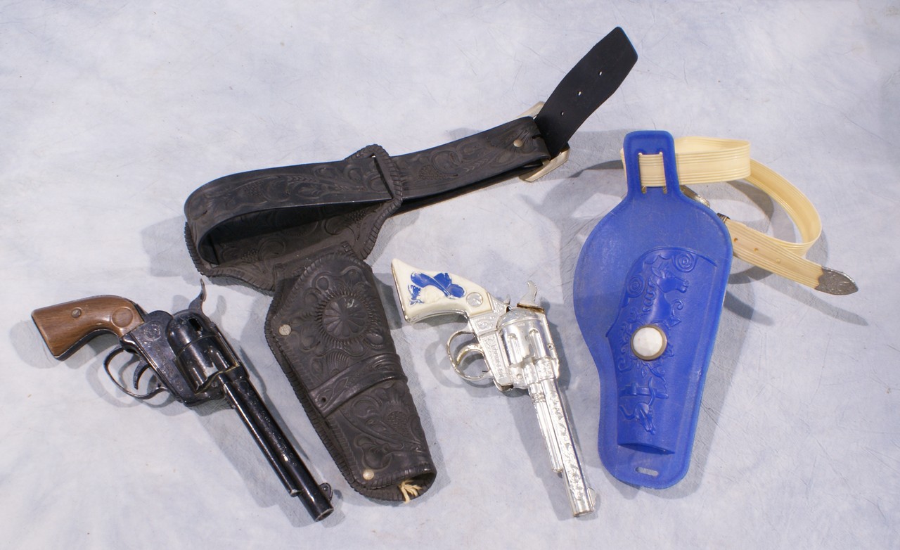 Appraisal: Plastic holster and cap gun sets blue one with Kilgore