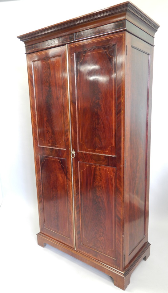 Appraisal: An Edwardian mahogany and box wood strung wardrobe the top