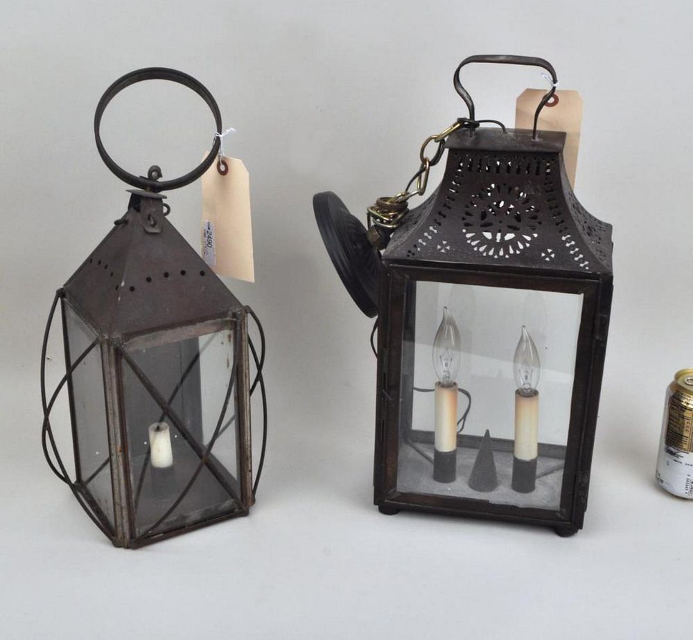 Appraisal: Two Early Tole Punchwork Lanterns comprising a square hanging lantern