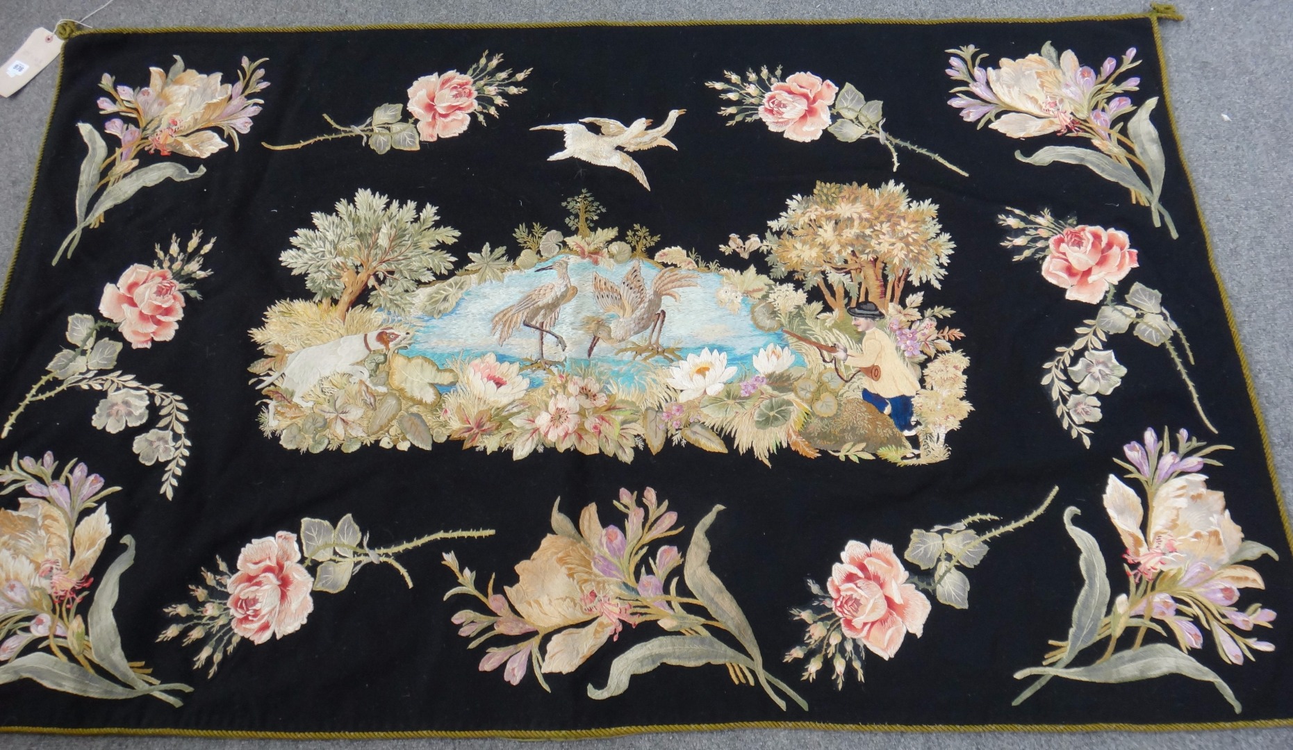 Appraisal: An embroided panel the black field with a central panel