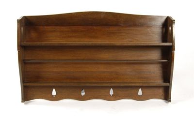 Appraisal: A Liberty Co stained oak plate rack with pierced heart