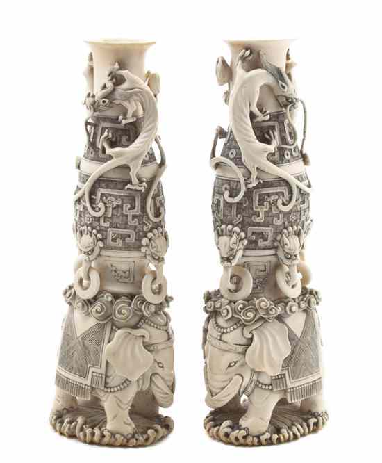 Appraisal: A Well-Carved Pair of Chinese Ivory Vases depicting a bottle