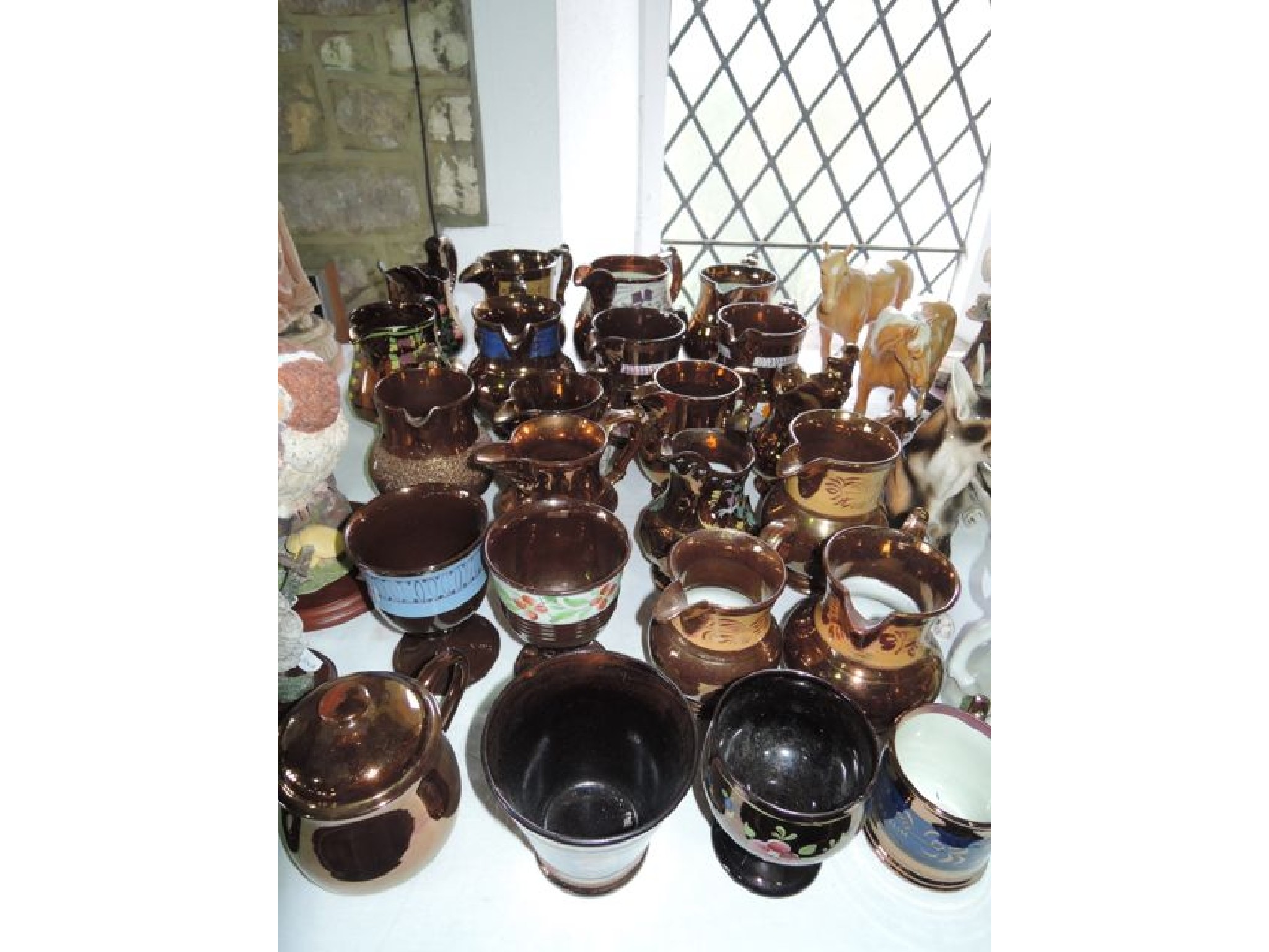 Appraisal: A quantity of th century copper lustre wares including jugs