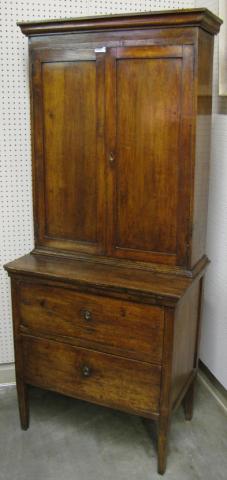 Appraisal: Primitive blind door cupboard with two drawers in cabinet base