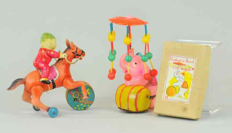 Appraisal: TWO CELLULOID TOYS Japan includes performing elephant w barrel whirligig