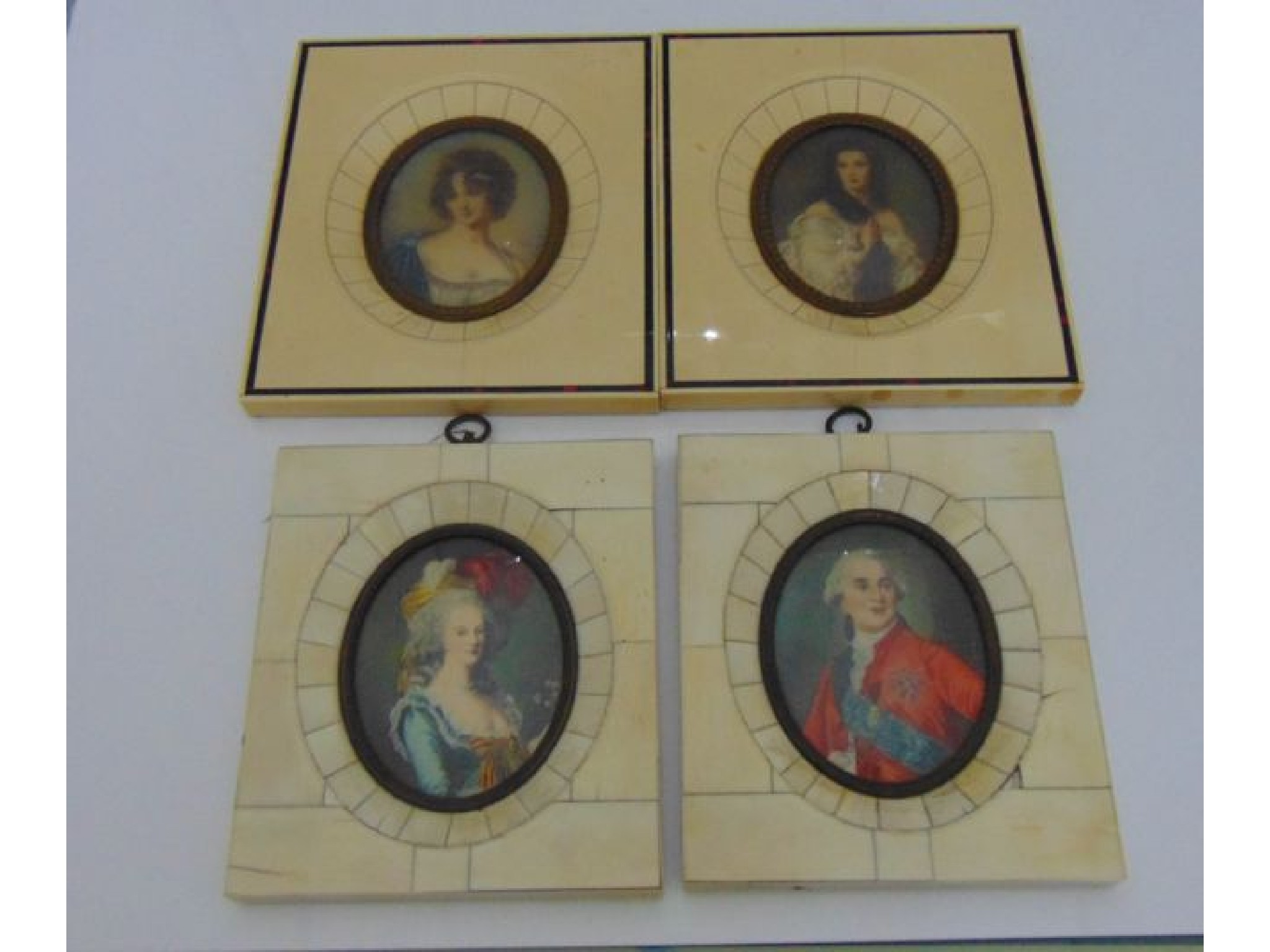 Appraisal: Four late th century oval miniature portraits th century society