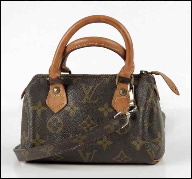 Appraisal: LOUIS VUITTON MONOGRAMMED CANVAS AND LEATHER MINI HL SPEEDY HANDBAG