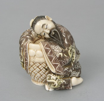 Appraisal: A Carved Ivory Figurine of A Man with Basket A