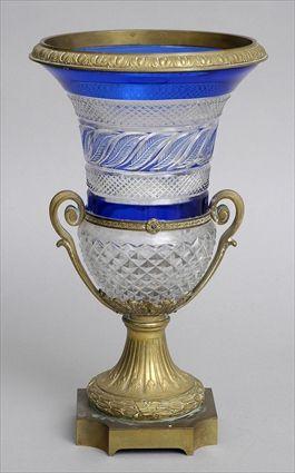 Appraisal: CHARLES X-STYLE GILT-METAL-MOUNTED CUT-GLASS CAMPANI-FORM URN The bowl with blue