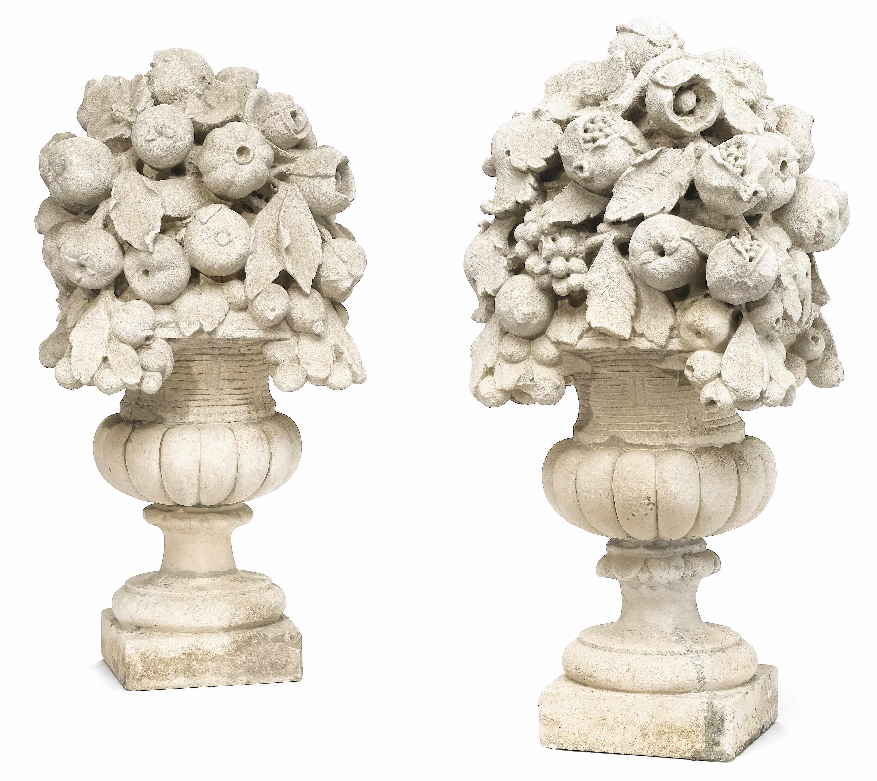 Appraisal: A pair of carved stone fruit and flower filled basket