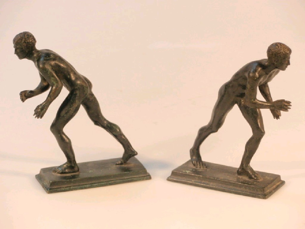 Appraisal: Two cast bronze figures of Greek athletes in oblong bases