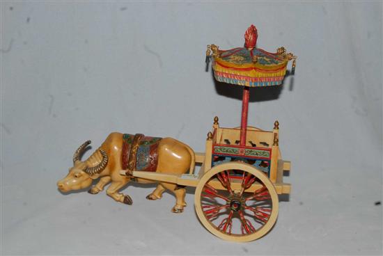 Appraisal: CHINESE IVORY GROUP Polychromed water buffalo pulling a cart with