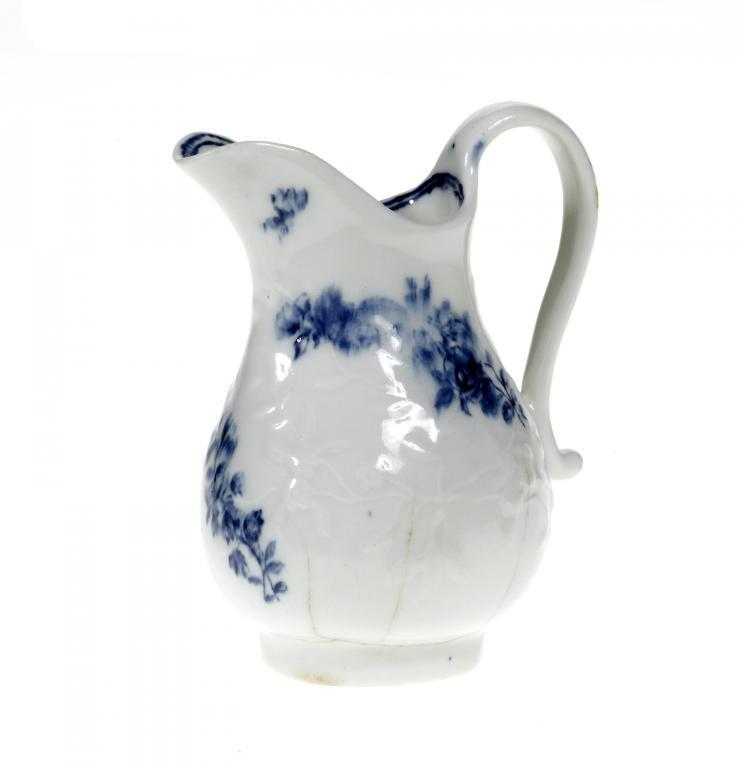 Appraisal: A DERBY CREAM JUG of baluster shape with strap handle