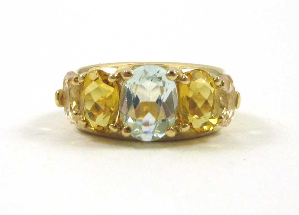 Appraisal: AQUAMARINE CITRINE AND KUNZITE RING k yellow gold set with