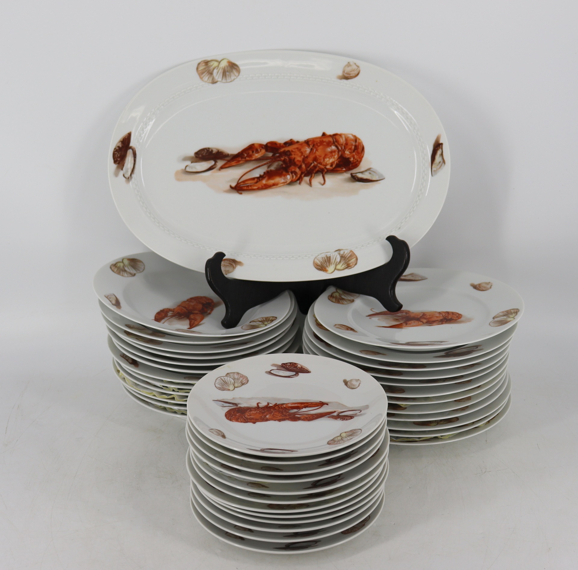 Appraisal: WEST GERMAN PORCELAIN LOBSTER SERVICE To include Plates Bowls Bowls