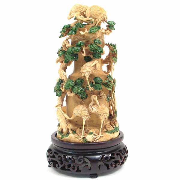 Appraisal: A Chinese reticulated ivory carving of Beauties and flowering tree