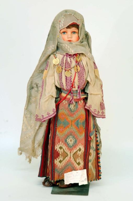 Appraisal: Composition head doll Cloth body Dressed in elaborate Arabian type