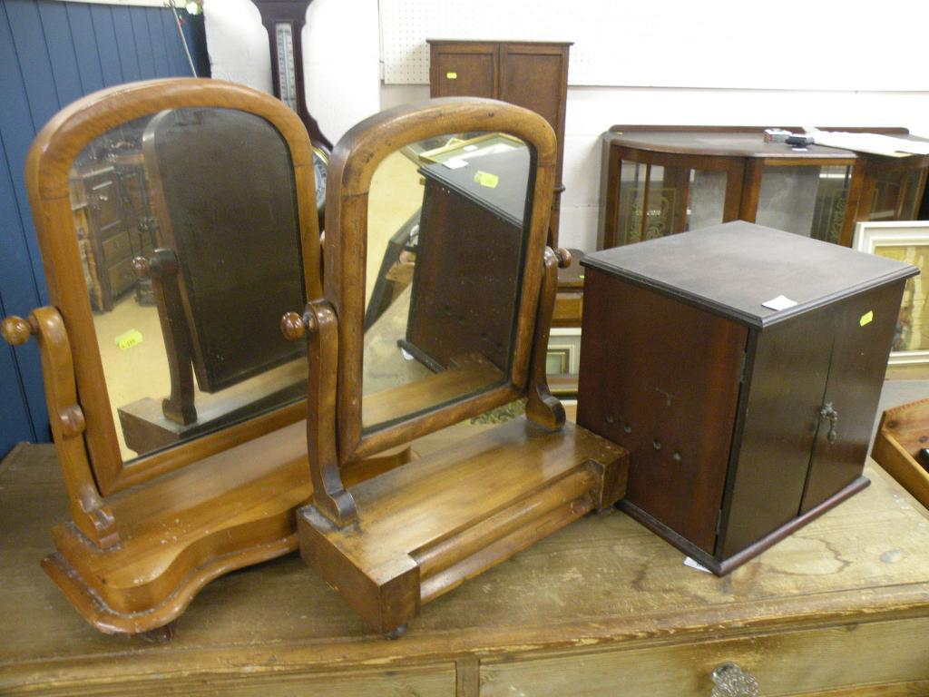 Appraisal: Two Victorian dressing table mirrors and a small mahogany cabinet