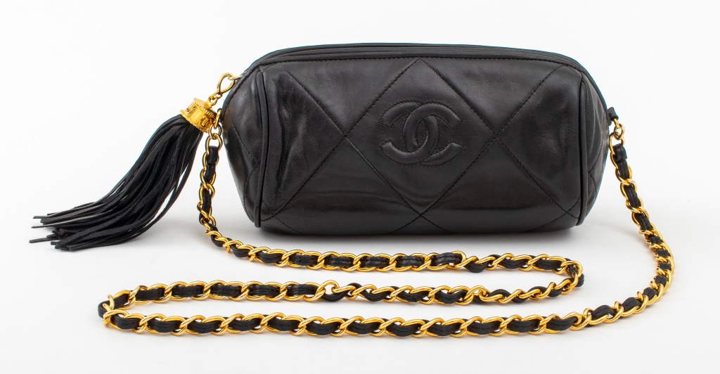 Appraisal: VINTAGE CHANEL BLACK QUILTED LEATHER CAMERA BAG Vintage Chanel camera