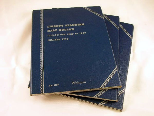 Appraisal: Three partial Whitman books of half dollars including ten Standing