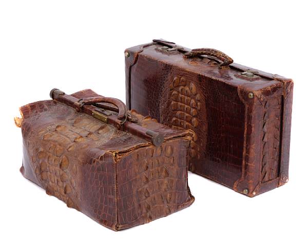 Appraisal: A set of three crocodile travel bags comprising a doctor's