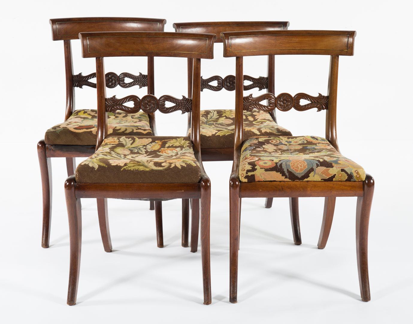 Appraisal: Regency carved mahogany side chairs circa curved brass stringer inlaid