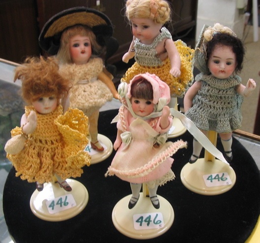 Appraisal: COLLECTION OF FIVE ALL BISQUE MINIATURE DOLLS jointed arms painted