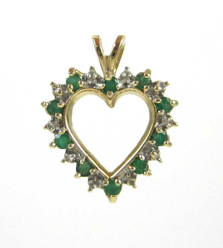 Appraisal: EMERALD DIAMOND AND TEN KARAT GOLD PENDANT The yellow and