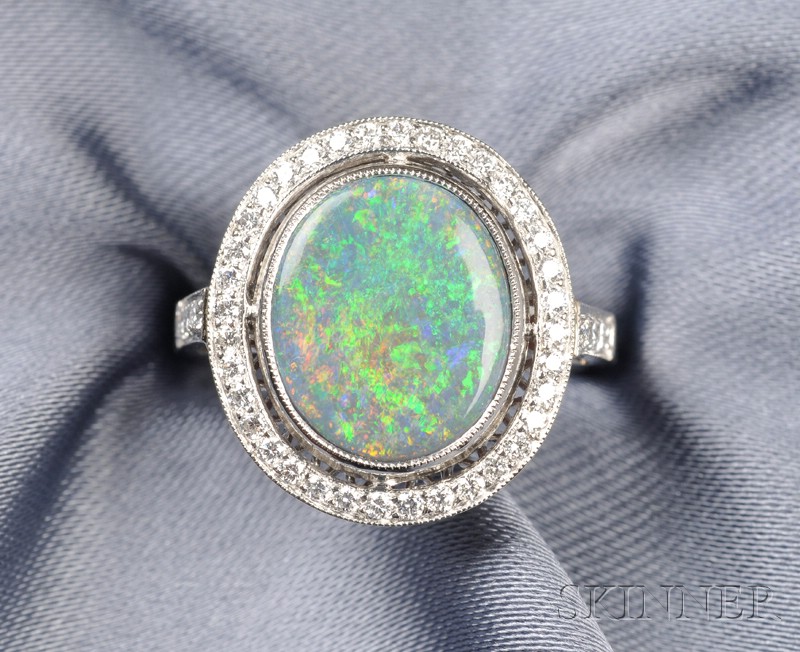 Appraisal: Platinum Opal and Diamond Ring bezel-set with an oval tablet