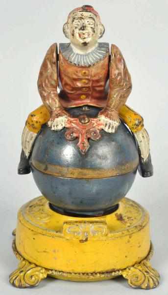 Appraisal: Cast Iron Clown on Globe Mechanical Bank Scarce yellow variations