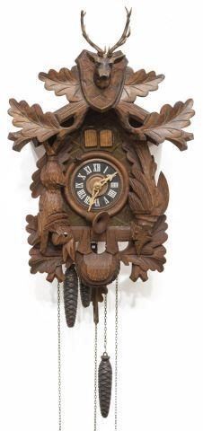 Appraisal: Vintage German carved cuckoo clock mid th c Regula featuring