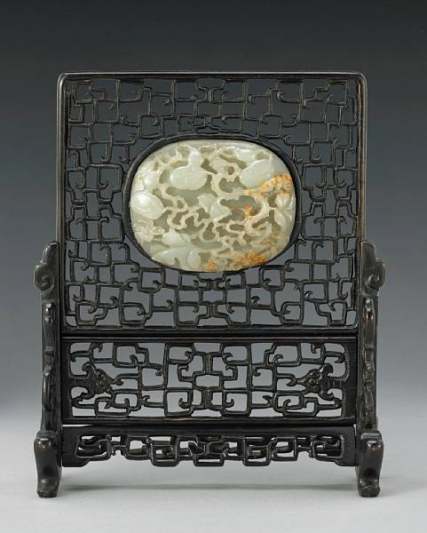 Appraisal: A carved nephrite plaque mounted as a table screen The