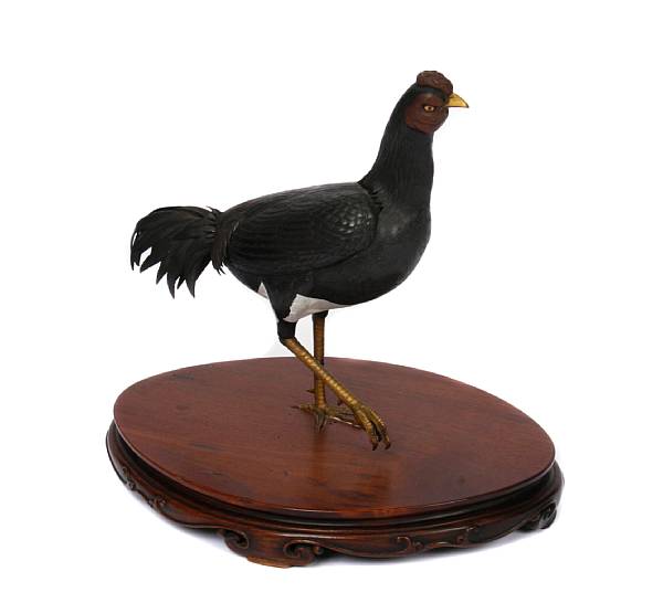 Appraisal: A Japanese patinated and gilt metal bird height in length