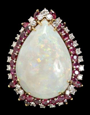 Appraisal: Opal ruby diamond ring central pear opal estimated weight cts