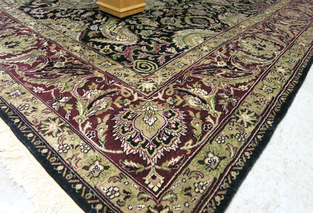 Appraisal: HAND KNOTTED ORIENTAL CARPET Indo-Persian overall floral design on dark