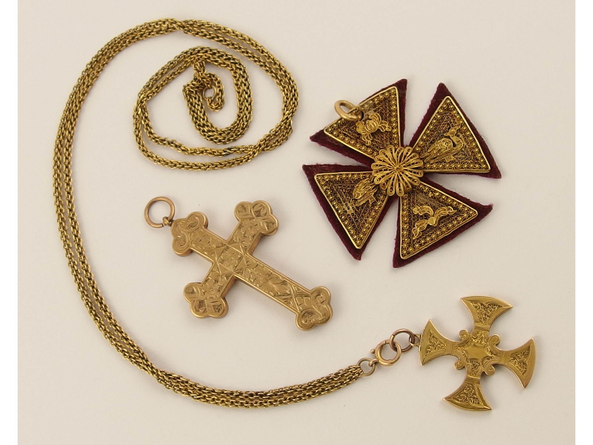 Appraisal: Three yellow metal decorative crosses