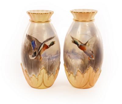 Appraisal: A pair of Royal Worcester baluster vases with gilt rimmed