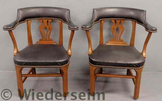 Appraisal: Pair of leather style barrel-back armchairs or smoker's chairs by