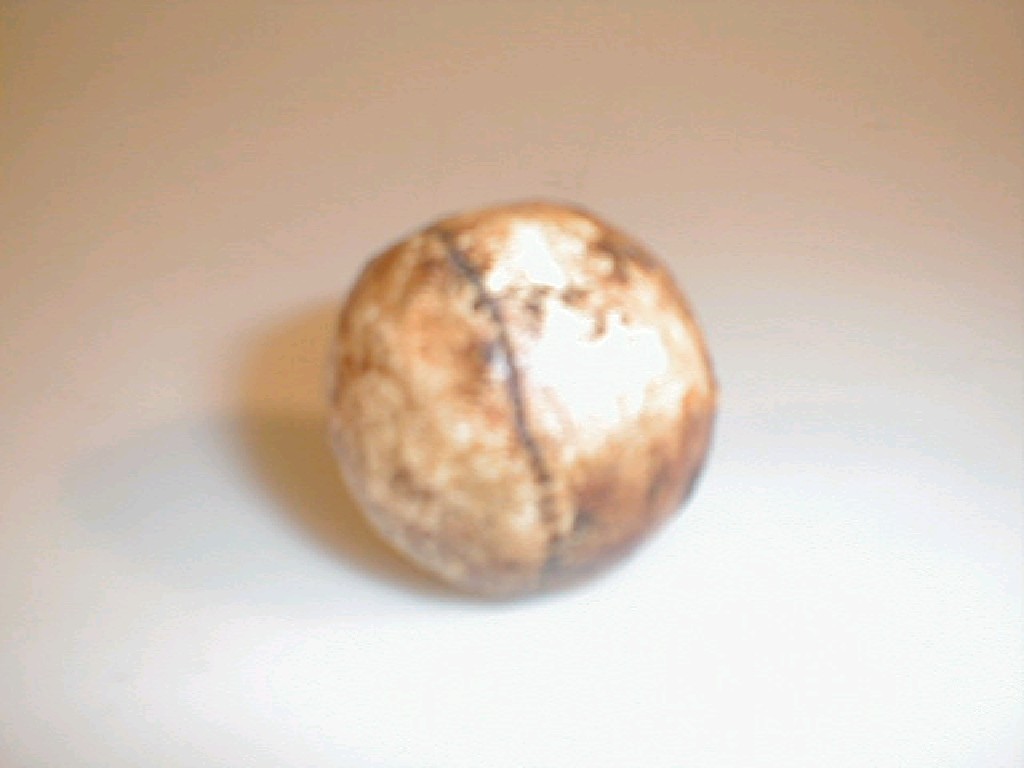 Appraisal: A reproduction feather golf ball with faux stitch marks and