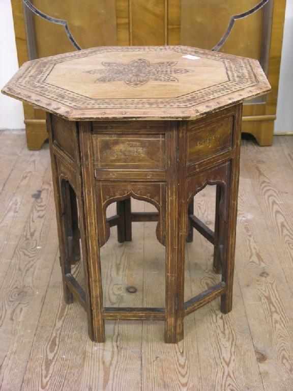 Appraisal: A Moorish octagonal table with elaborate inlay ft in