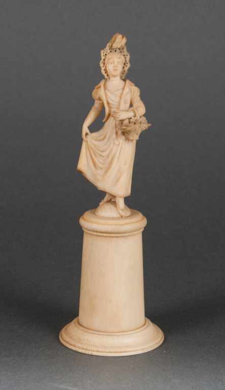 Appraisal: Continental carved ivory figure of a maiden with a basket