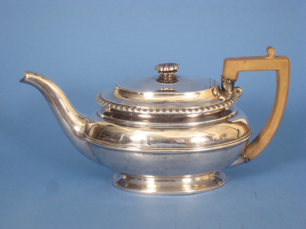 Appraisal: A George III oval Teapot with lobed rim flower finial