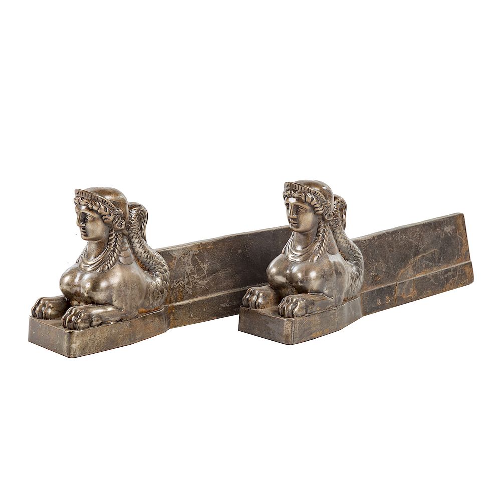 Appraisal: Pair iron Sphinx-form fire dogs th century in H W