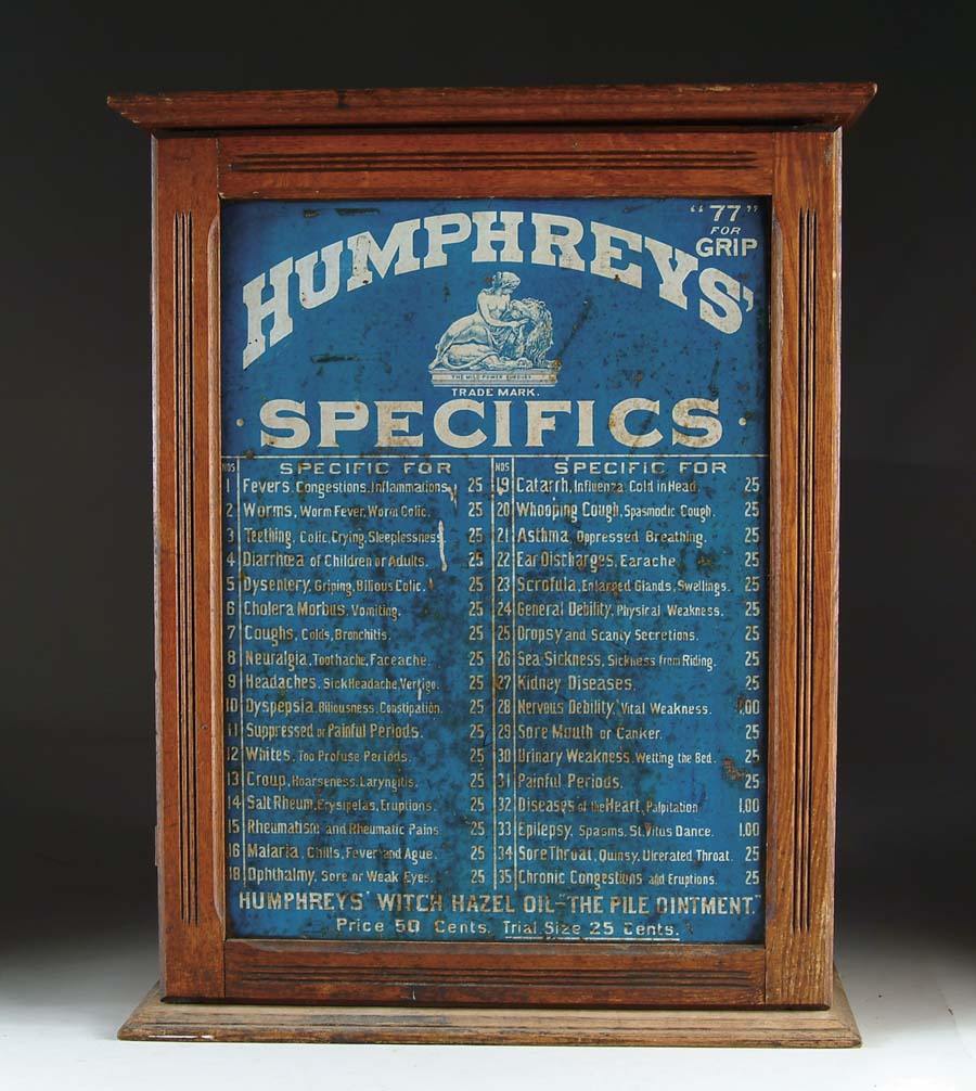 Appraisal: HUMPHREYS SPECIFICS DISPLAY CABINET This homeopathic remedy cabinet features tin