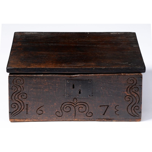 Appraisal: A Charles II boarded oak box the front carved with